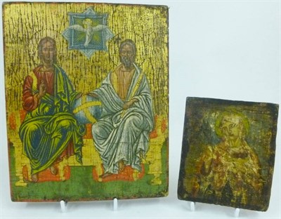 Lot 1112 - A Russian Icon, probably 18th century, depicting Christ and St Nicholas(?) seated on a...