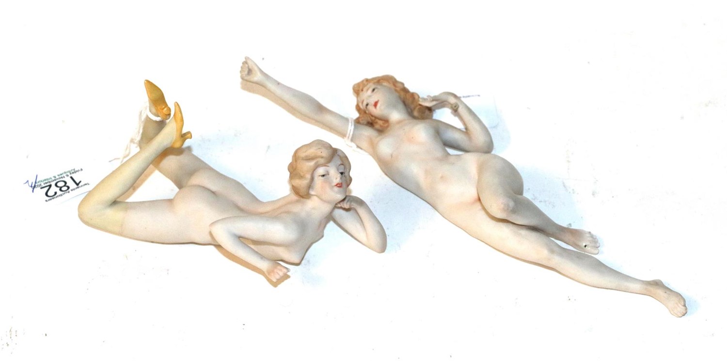 Lot 182 - An early 20th century German bisque figure of a nude young woman, unmarked, modelled lying on front