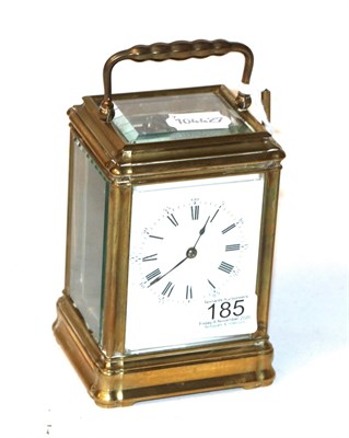 Lot 185 - A French brass carriage clock, enamel Roman and Arabic dial, with key, movement back plate...