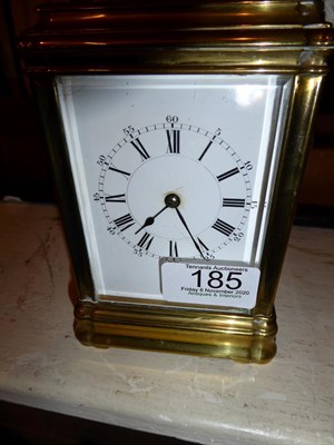 Lot 185 - A French brass carriage clock, enamel Roman and Arabic dial, with key, movement back plate...