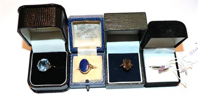 Lot 209 - A 9 carat gold lapis lazuli ring, finger size N1/2; a 9 carat gold smokey quartz ring, finger...