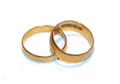 Lot 233 - Two 22 carat gold band rings, finger sizes M