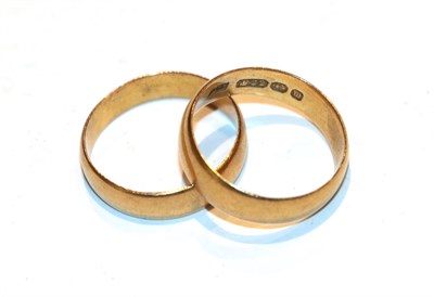 Lot 235 - Two 22 carat gold band rings, finger sizes N and N1/2