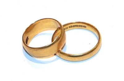 Lot 238 - Two 22 carat gold band rings, finger sizes H and O
