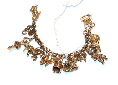 Lot 241 - A charm bracelet, each link stamped '9' and '.375', hung with various charms including a ballerina