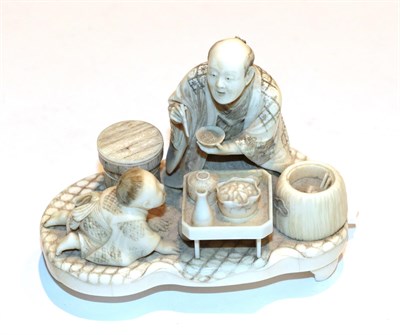 Lot 244 - A late 19th century Japanese carved ivory okimono group, 9cm high