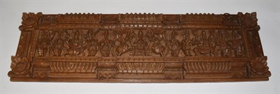 Lot 273 - An Indian carved wood panel, depicting Deities, possibly a temple plate