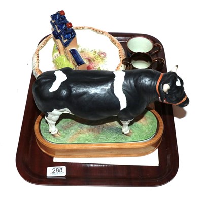 Lot 288 - A Royal Worcester porcelain figure of a Holstein-Friesian bull by Doris Lindner, with stand and...