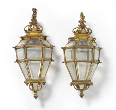 Lot 1124 - Two Very Similar Gilt Brass Hexagonal Hanging Lanterns, circa 1900, each with scrolled surmount...