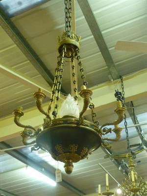 Lot 1128 - A Gilt Brass Eight-Branch Ceiling Light, in Regency style, the central green painted compressed...