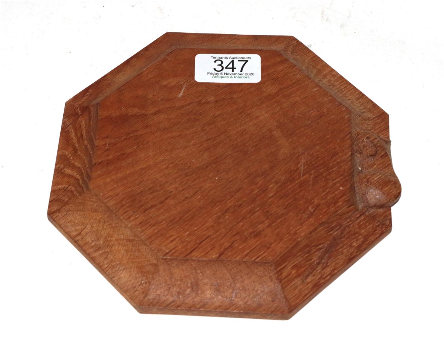 Lot 347 - Workshop of Robert 'Mouseman' Thompson, octagonal oak teapot stand, with carved mouse signature