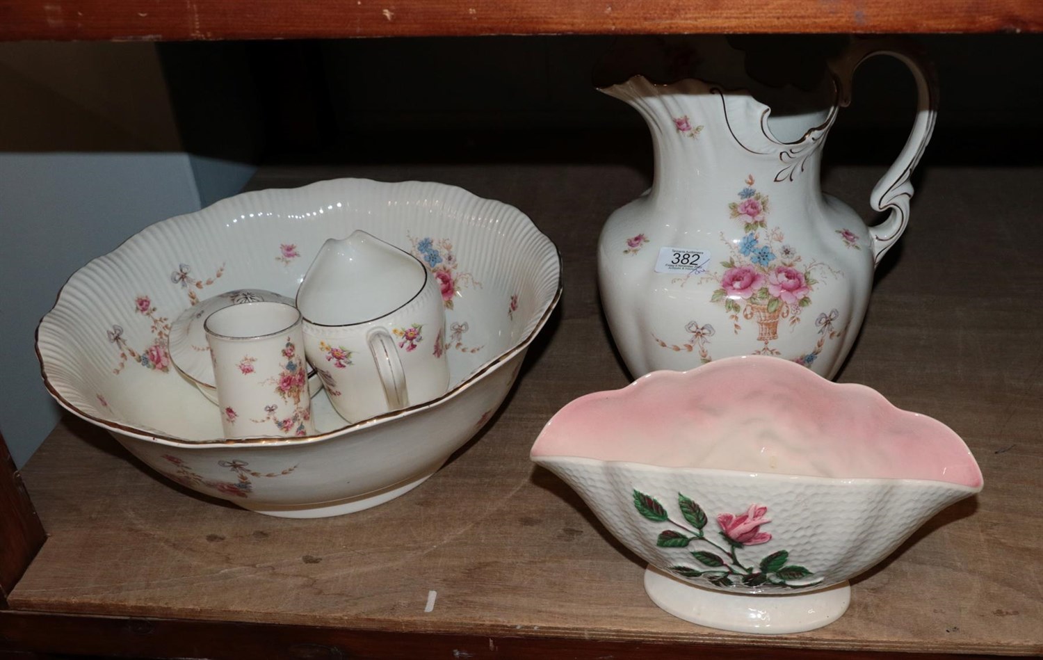 Lot 382 - A Grimwade's wash basin and water jug; a Devon ware five piece wash set; a Malin lustre bowl; a...