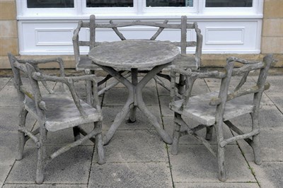 Lot 1137 - A Cast Concrete Bois Garden Seat, 20th century, naturalistically modelled as tree branches...