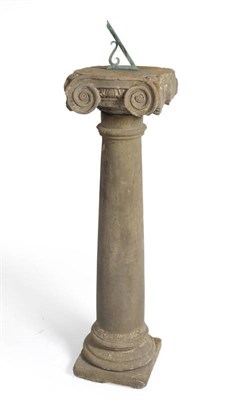 Lot 1144 - A Stone Sundial, 18th century, the bronze scroll gnomon within an integral engraved sun dial...