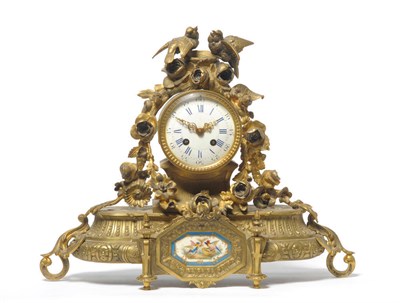 Lot 1156 - A Gilt Metal and Porcelain Mounted Striking Mantel Clock, circa 1890, surmounted with birds and...