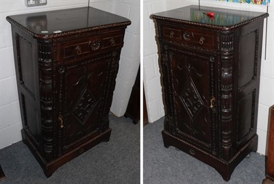 Lot 1240 - A pair of Victorian carved oak side cabinets, 67cm by 45cm by 111cm