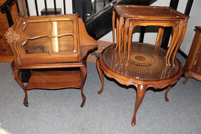 Lot 1250 - A reproduction circular cane and glass top coffee table; a walnut hanging corner cupboard with base