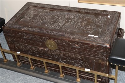 Lot 1254 - A Chinese carved hardwood chest