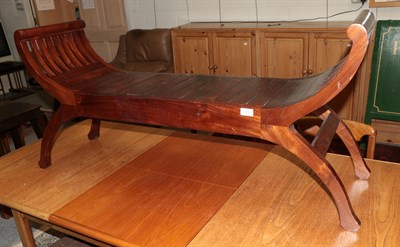 Lot 1259 - A reproduction hardwood bench, with scrolled end supports, 123cm wide