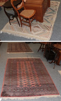 Lot 1264 - An Anatolian Kilim the field of poly chrome bands of geometric devices enclosed by zig zag borders