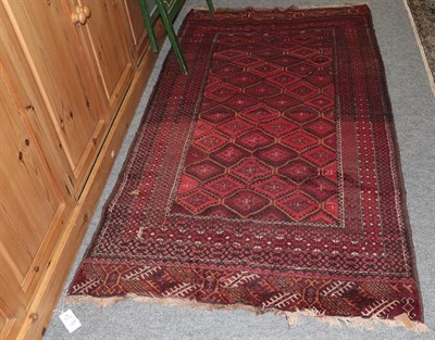 Lot 1265 - A Bukhara style rug, the central field of lozenges on a red brick ground, among narrow borders,...