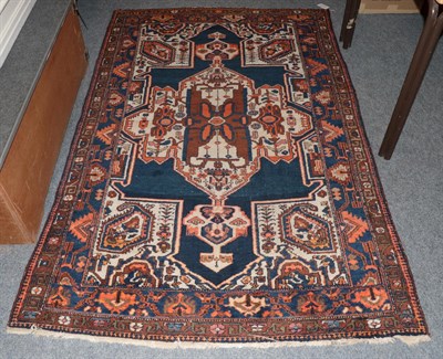 Lot 1267 - A Hamadan rug, indigo field with large medallion framed by double borders, 210cm by 133cm