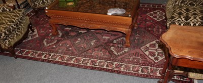 Lot 1268 - Bakhtiyari rug, down lattice field enclosed by meandering vine border, 300cm by 215cm