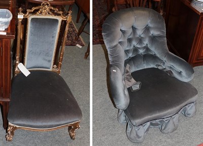 Lot 1288 - A 19th century carved gilt-wood nursing chair, upholstered in blue velvet; and a Victorian...