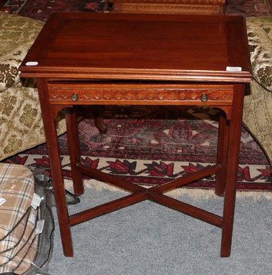 Lot 1292 - A mahogany blind fret carved fold-over card table, 61cm by 38cm by 71cm high