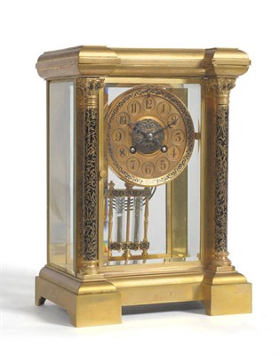 Lot 1166 - A Gilt Brass Four Glass Striking Mantel Clock, circa 1890, with black enamelled Corinthian columns