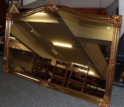 Lot 1300 - A reproduction large gilt frame over-mantle mirror, 114cm by 183cm