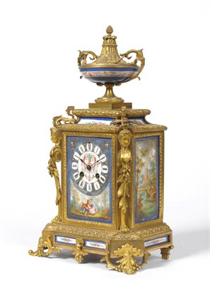 Lot 1167 - A French Gilt Metal and Porcelain Mounted Striking Mantel Clock, circa 1880, surmounted with an urn