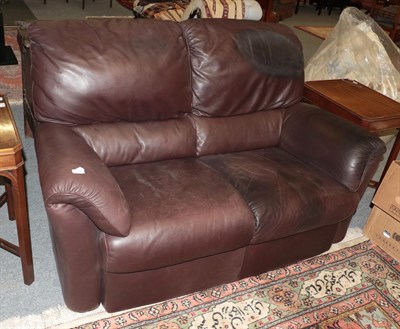 Lot 1317 - A brown two-seater leather sofa