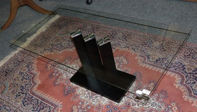 Lot 1325 - A modern glass-top coffee table, with black ash base, 119cm by 60cm by 47cm