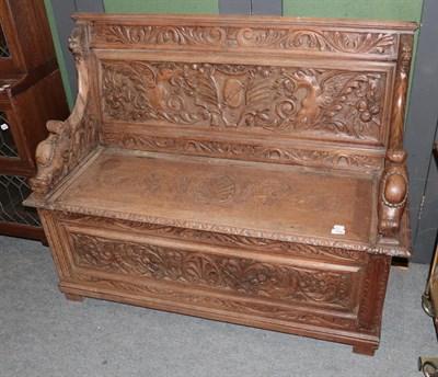 Lot 1343 - A Victorian carved oak monks' bench, 127cm by 46cm by 99cm high