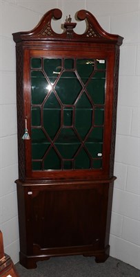 Lot 1350 - A 19th century mahogany floor standing glazed corner cupboard