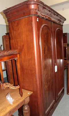 Lot 1362 - A Victorian mahogany double door wardrobe, with moulded panel doors, the interior with hanging...