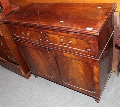 Lot 1365 - A George IV mahogany side cabinet with a two-as-one drawer over cupboard doors, 99cm by 43cm by...