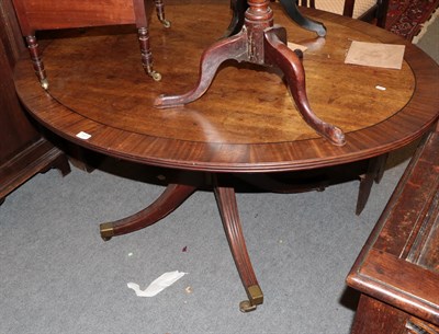 Lot 1371 - A George III mahogany and crossbanded oval breakfast table, 136cm by 105cm by 70cm