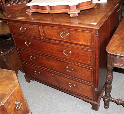 Lot 1378 - A Georgian oak and crossbanded chest of drawers, 108cm by 55cm by 99cm