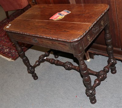 Lot 1380 - A Victorian carved oak library table with two small drawers, turned legs and H-stretcher, 95cm...