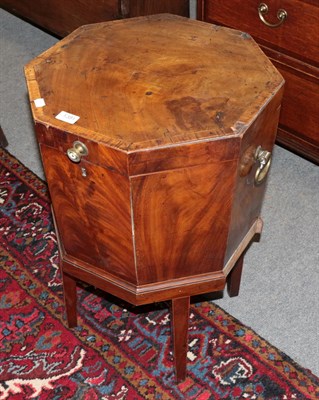 Lot 1381 - A George III mahogany octagonal cellaret on stand