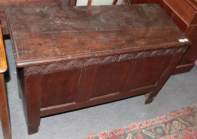 Lot 1385 - A 17th century oak chest with lunette carved frieze