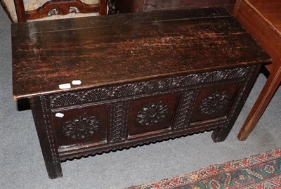 Lot 1387 - An 18th century carved oak chest with later hinged lid, 107cm by 46cm by 80cm high