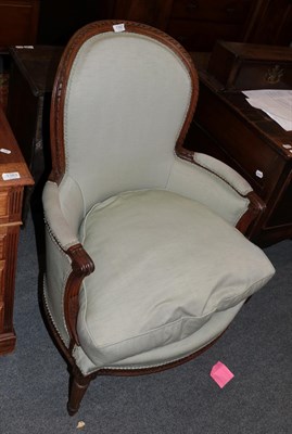 Lot 1392 - A 19th century French walnut framed armchair in celadon fabric with squab cushion (legs re-tipped)