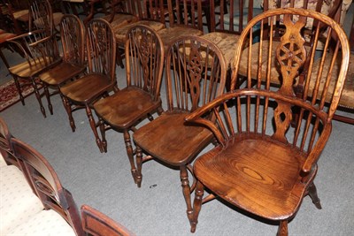 Lot 1398 - A set of six reproduction Titchmarsh & Goodwin oak wheel-back Windsor chairs, including two carvers