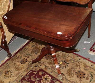 Lot 1409 - A Regency mahogany and ebony-strung fold-over tea table