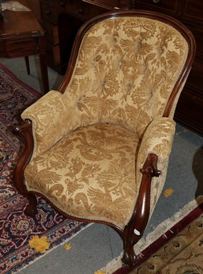 Lot 1410 - A Victorian carved mahogany button-back armchair