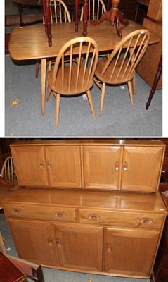 Lot 1413 - An Ercol elm dining suite comprising a sideboard, 136cm by 46cm by 123cm, a dining table, 152cm...