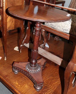 Lot 1436 - An early 19th century mahogany circular tripod table, with tri-form base and turned feet, 47cm...